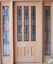 2 1/4 inch Thick Honduran Mahogany G115 style door with S01 sidelights. Featuring insulated stained glass. Custom proportions preferenced by client.