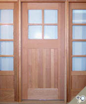 G132 / S12 entrance unit. Shown in Spanish cedar with clear insulated glass. V-Grooved flat panel design carried over onto sidelights to match