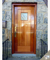 Custom Honduran Mahogany entry door with insulated original pattern 62 decorative glass.