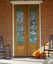 Double Signature White Oak storm doors with solid brass mortise knob/lever set and ball tip hinges. Browse more Traditional door deisgns which can be made into a double door like this one.